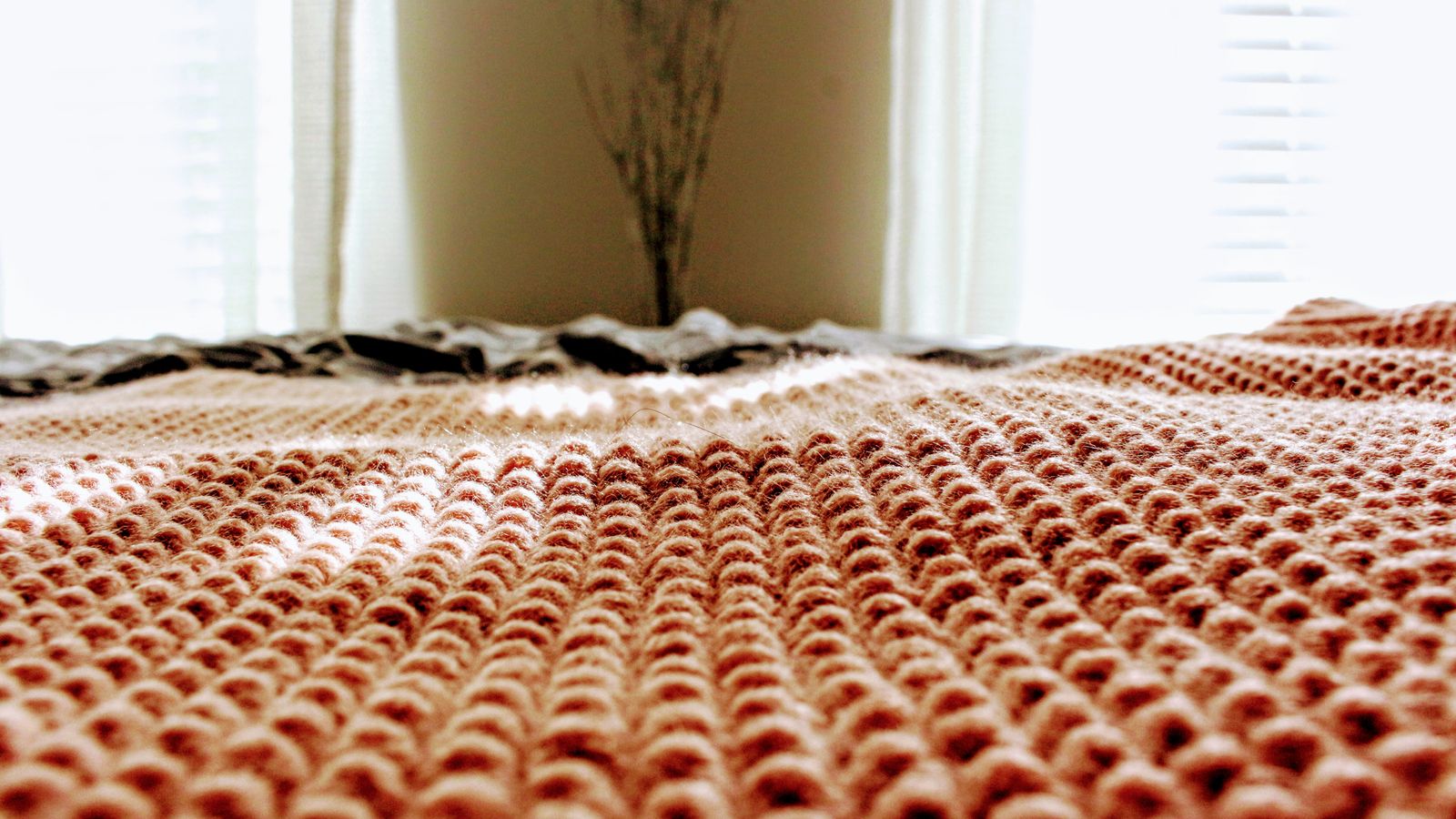 Neatly folded bed linens and blankets ready for a rotation storage system