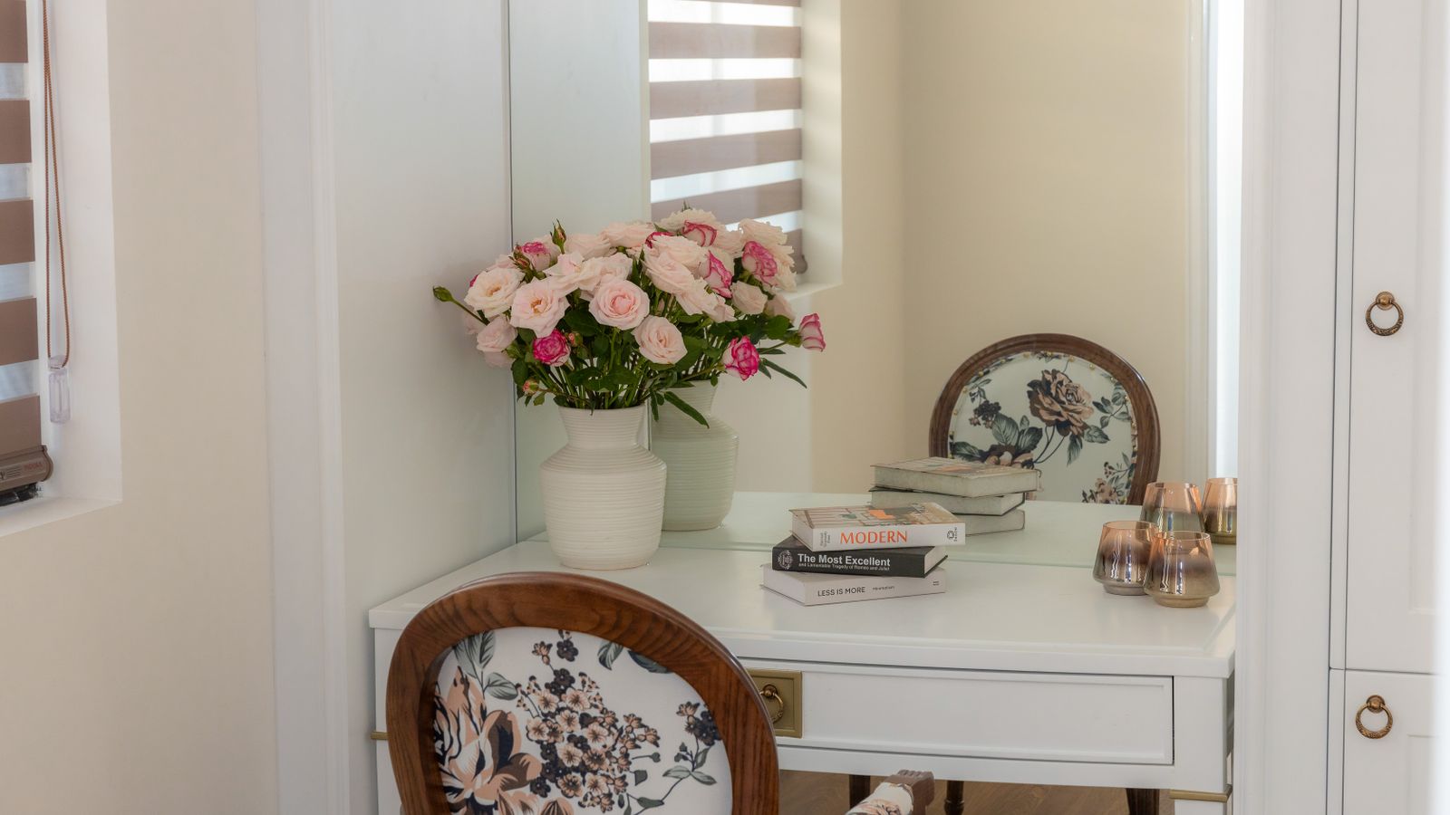Vanity desk with mirror and organized storage in a bedroom corner