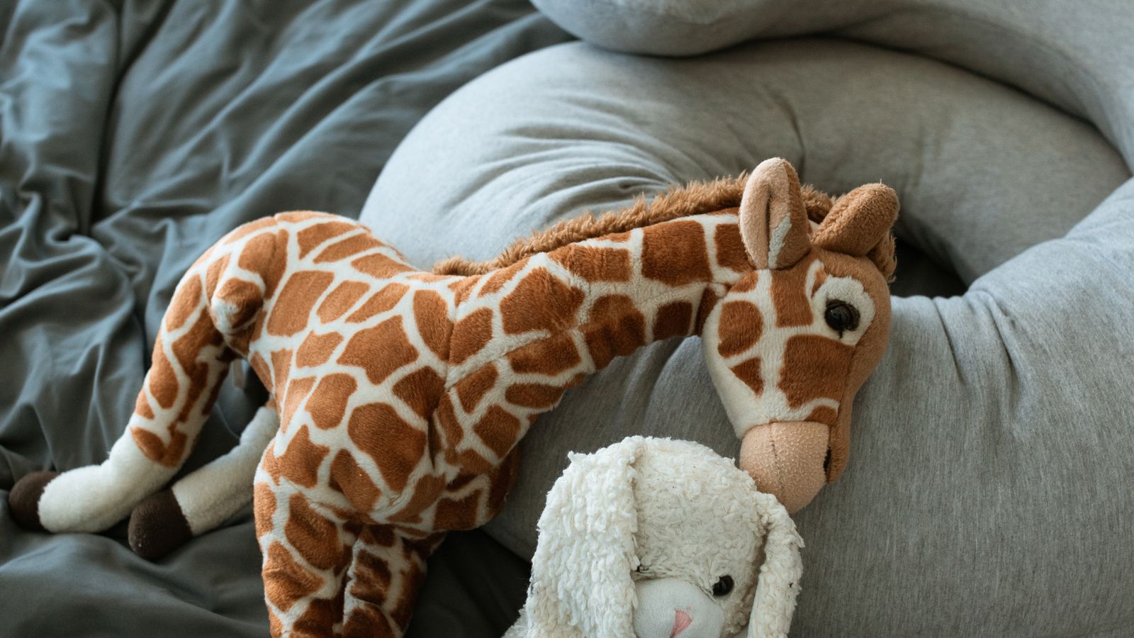 Soft nursing pillow with fabric cover in a nursery setting