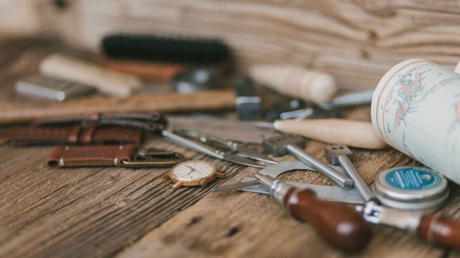 Leather repair kit with tools and color compounds laid out for cleaning