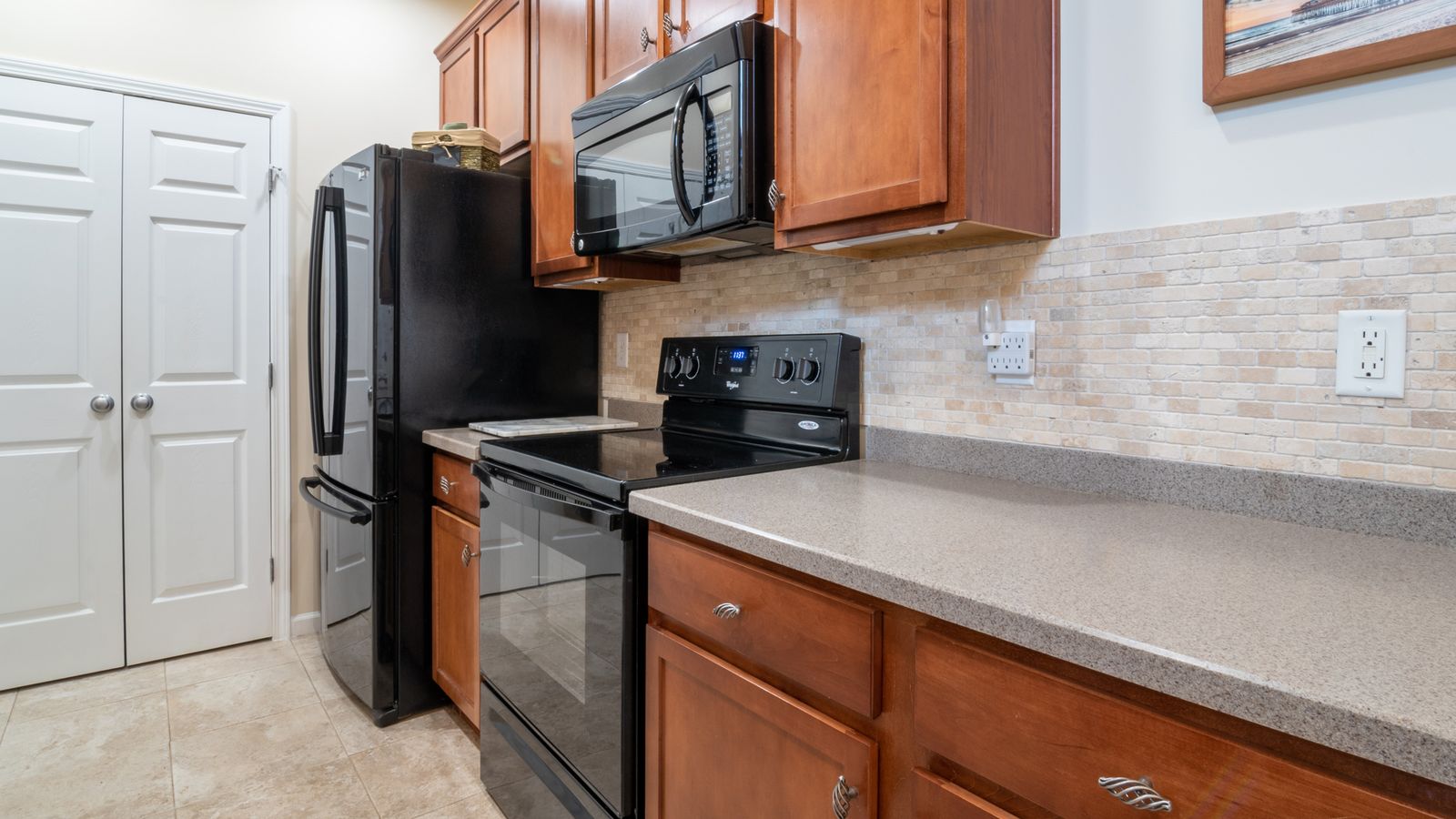 Compact kitchen counter with a few essential appliances neatly arranged