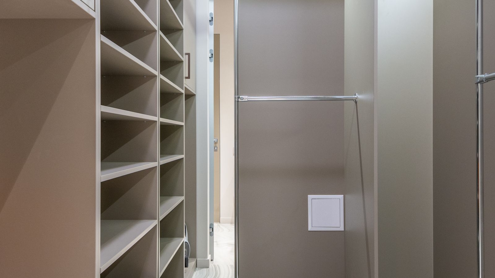 Neatly folded clothing stacked in fabric storage bins on closet shelving