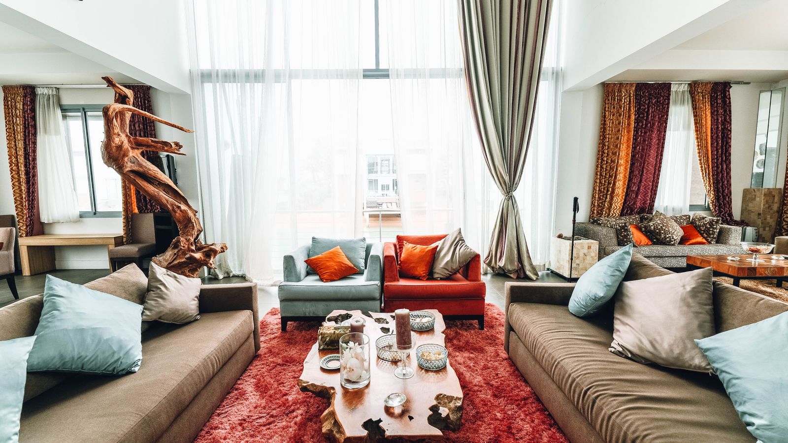 Bright modern living room with sofa, coffee table, and natural light