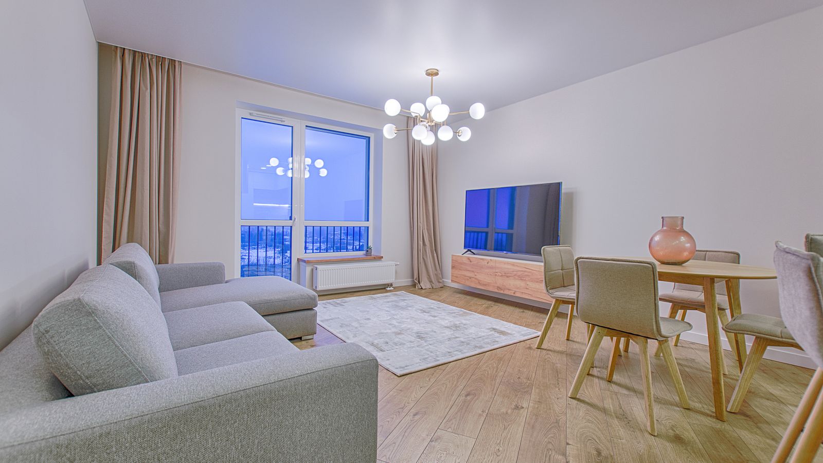 Living room seating arrangement with round coffee table and accent chair