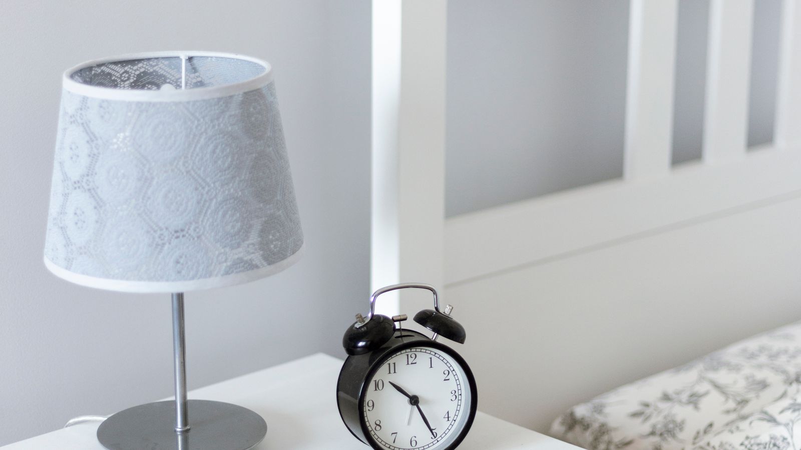 Low-profile nightstand positioned beside an adjustable bed frame