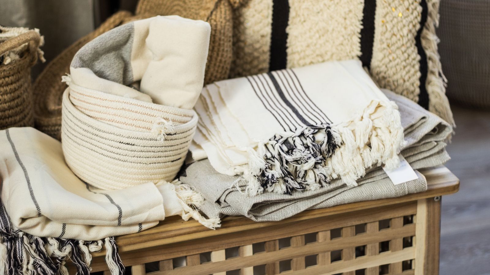Organized closet shelving with matching baskets grouped by category