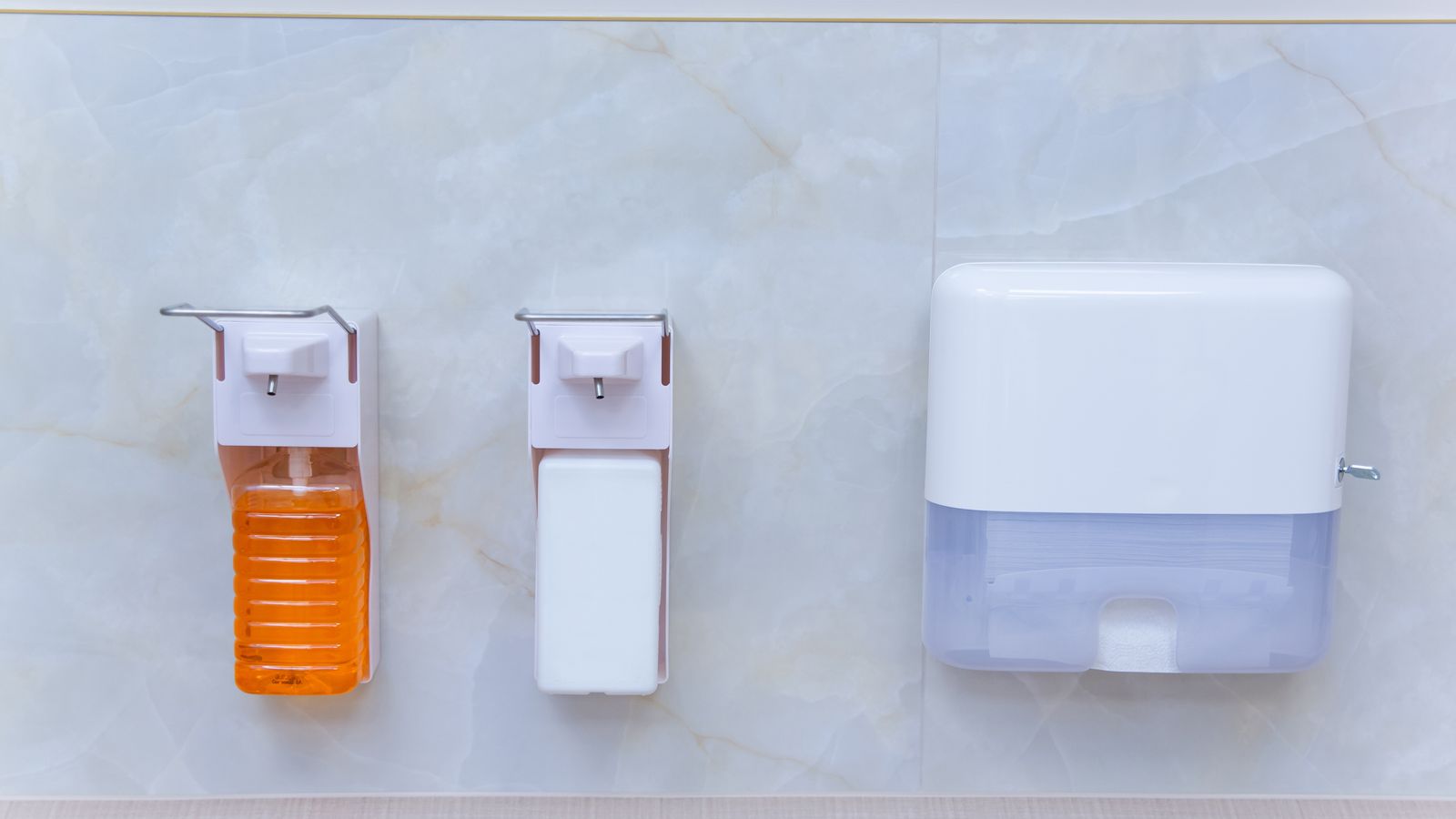 Modern bathroom sink counter organized with a soap dispenser and minimal decor