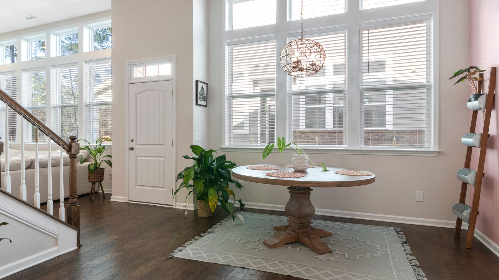 Natural jute rug texture laid over a dining room floor near a table