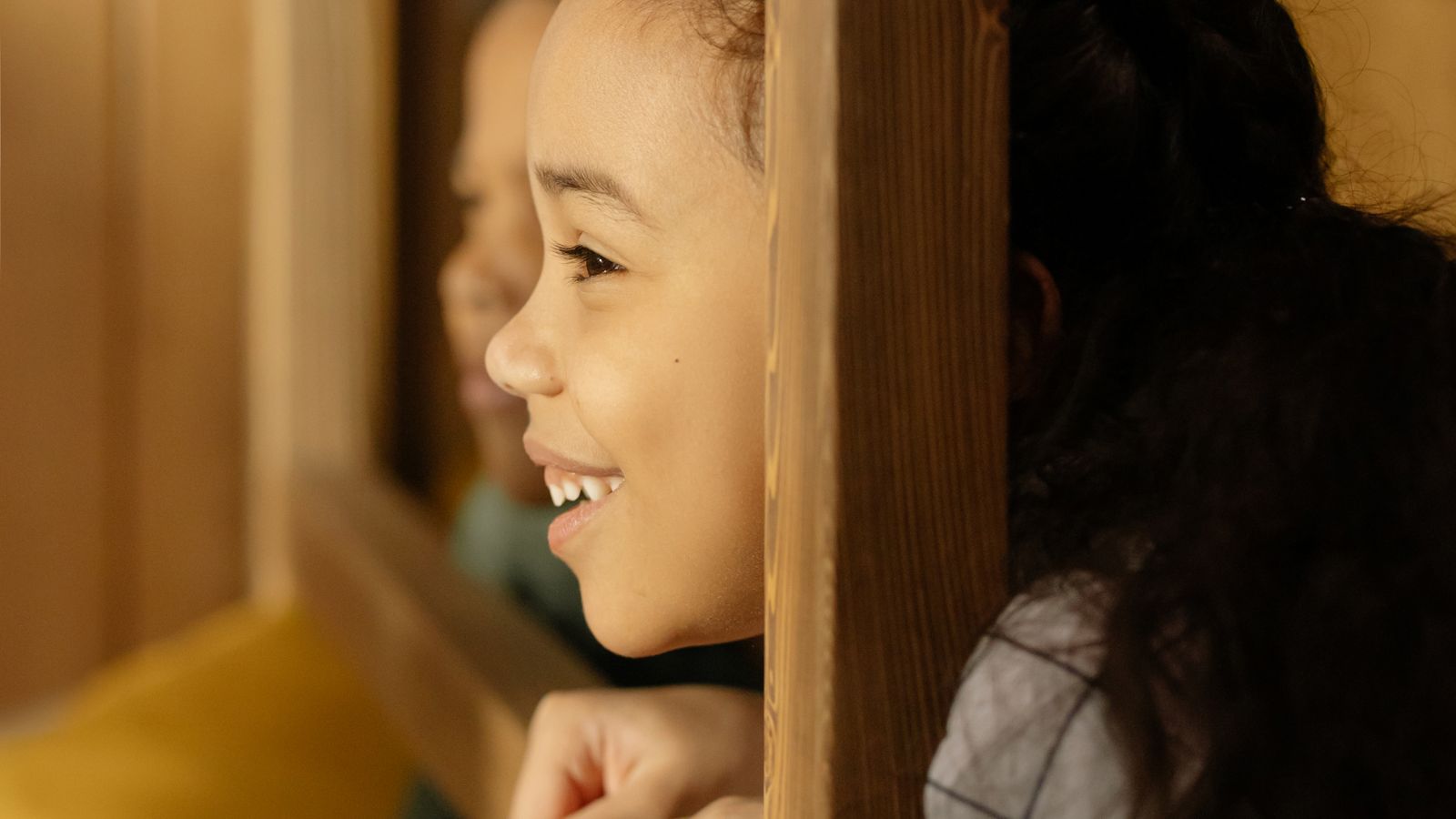 Close-up of a metal bunk bed ladder rung mounted to a bed frame