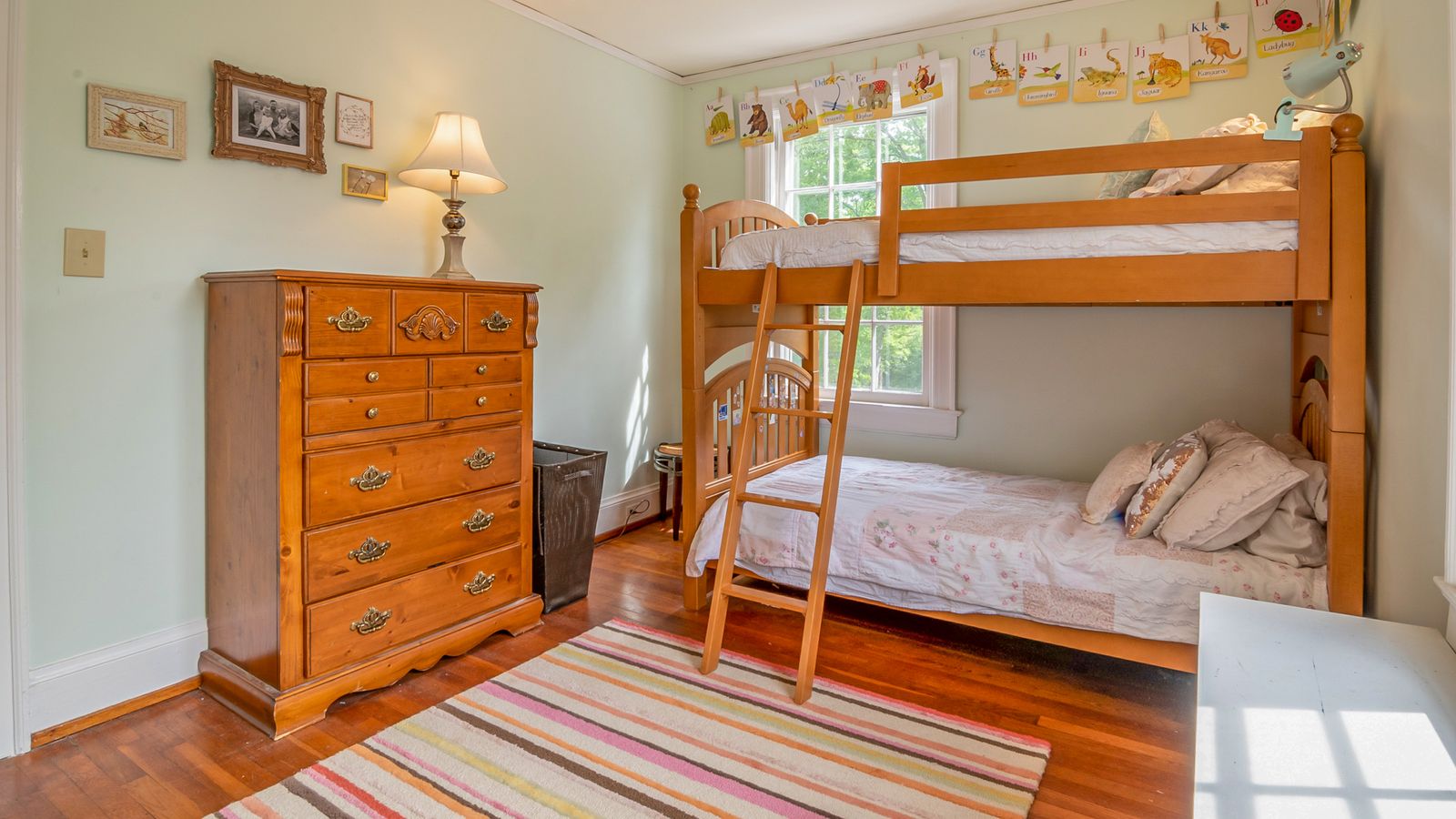 Compact bedroom with a bunk bed set up using a slim bunkie board for extra headroom