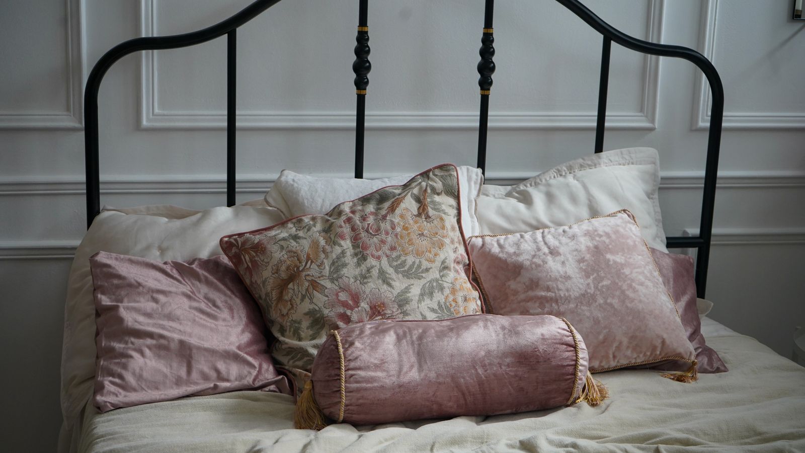Assembled California king bed frame with headboard in a bright bedroom