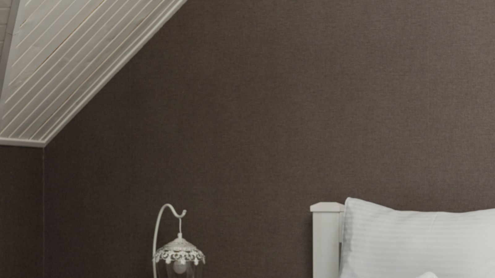 Folded percale bed sheets in a linen closet stack