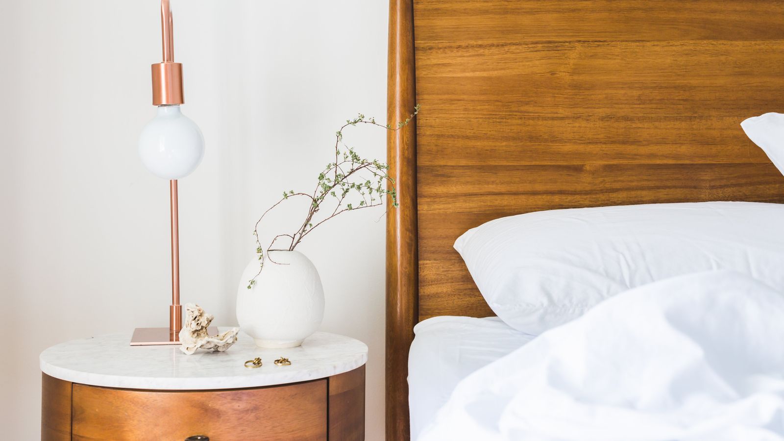 Neatly organized bedroom dresser drawer with folded clothes and storage dividers