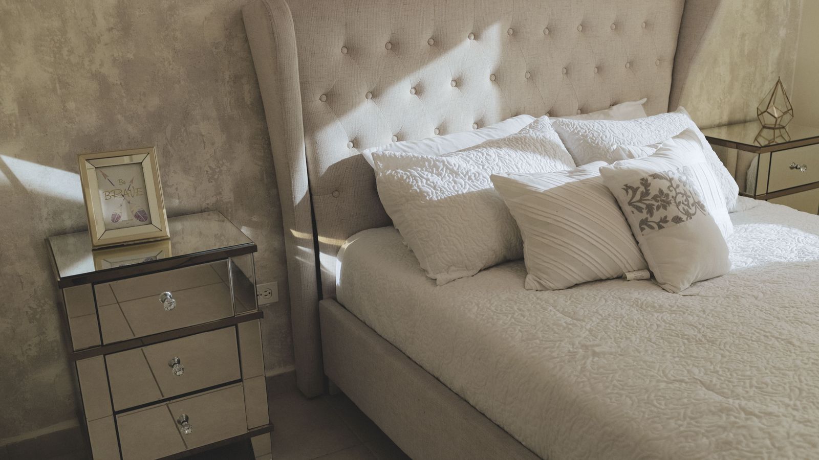 Assembling an affordable metal bed frame in a bright bedroom