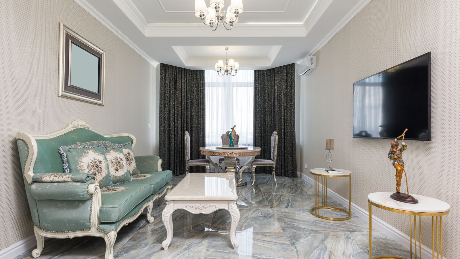 Marble top coffee table styled in a minimalist living room seating area