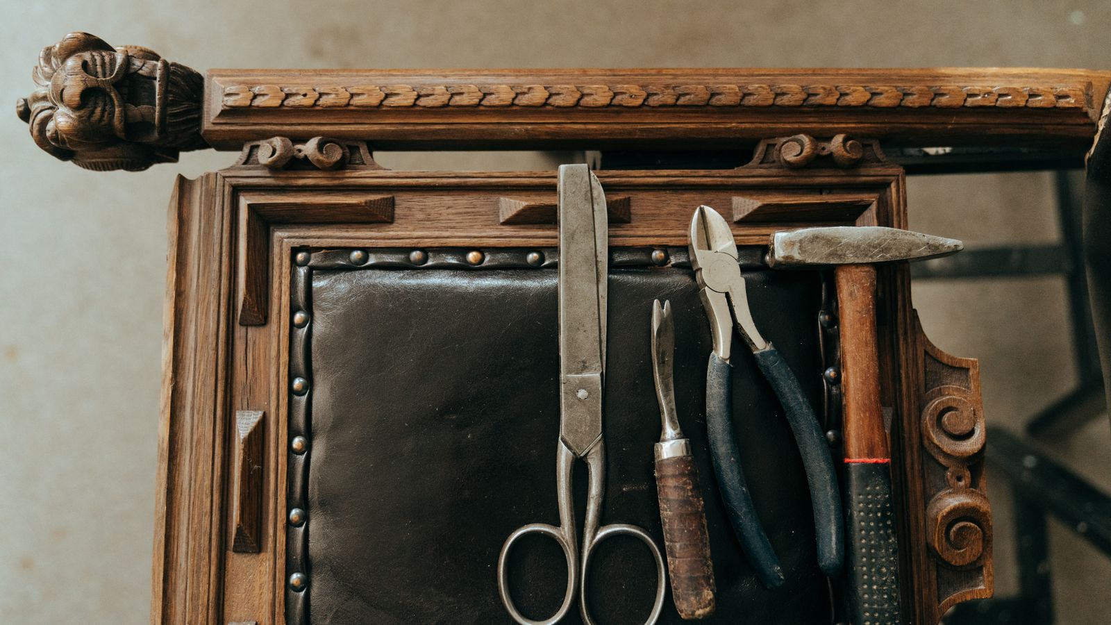 Organized furniture repair toolkit with staple gun, polish, and hardware