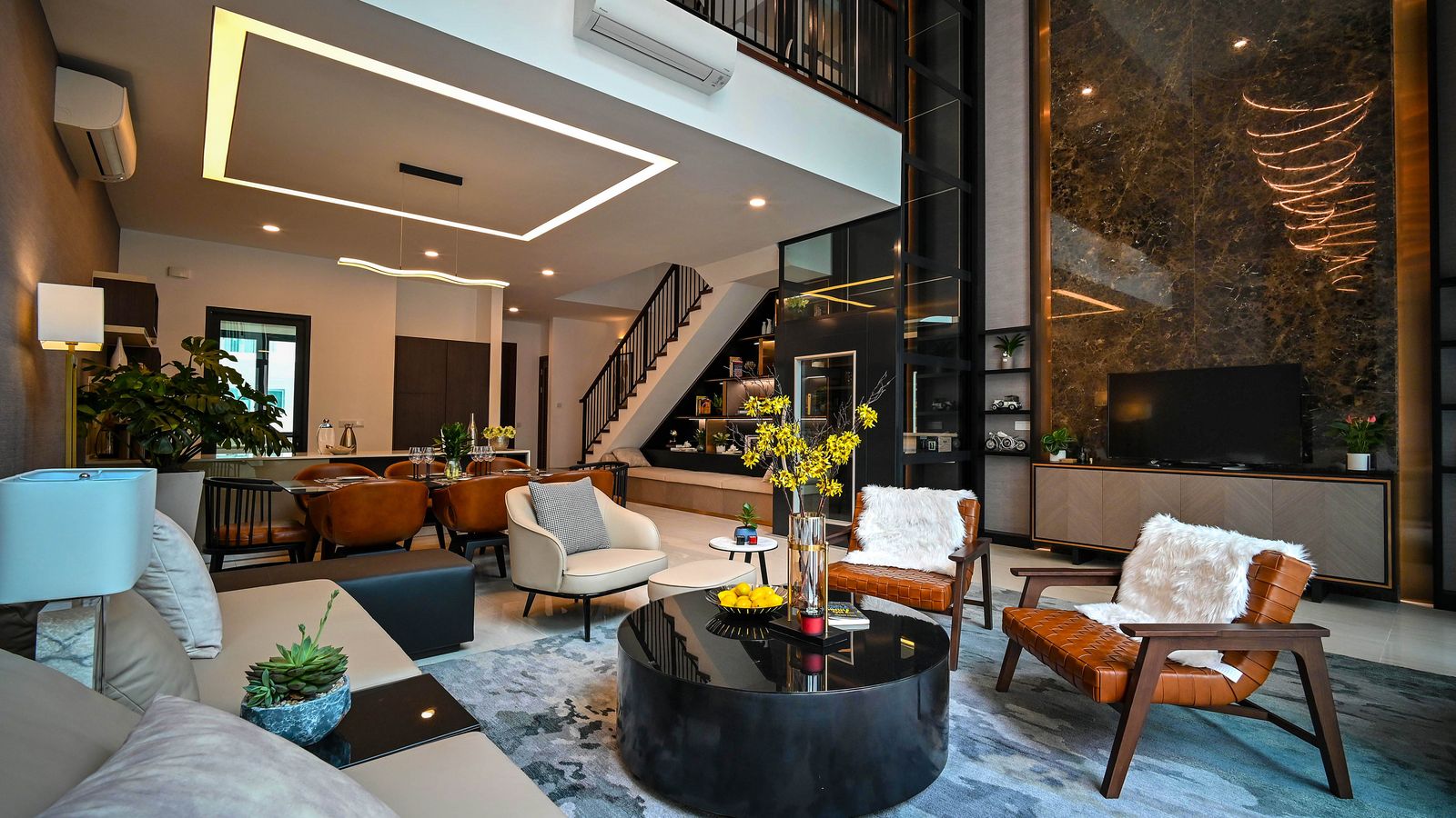Living room seating area featuring layered textures and a functional coffee table setup