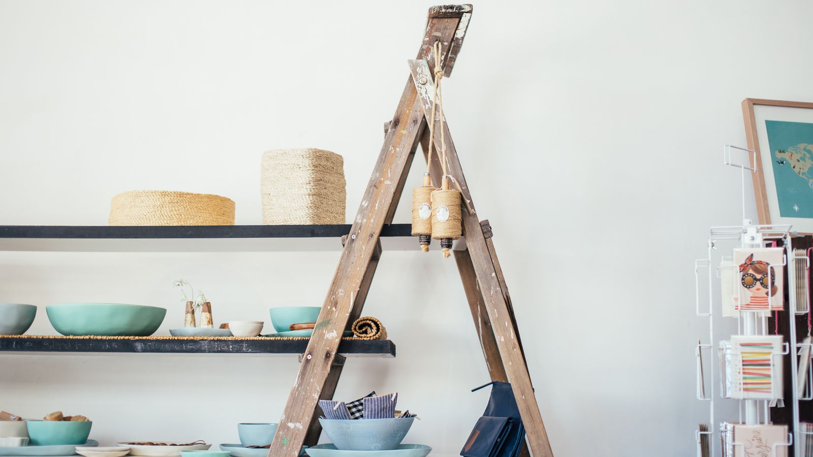 Living room styled with a ladder shelf, sectional, and low coffee table