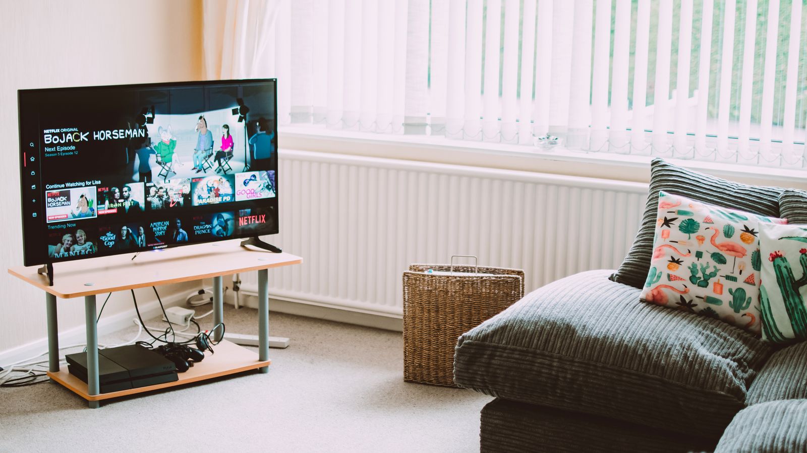 Wide coffee table positioned in front of a sectional sofa in a living room