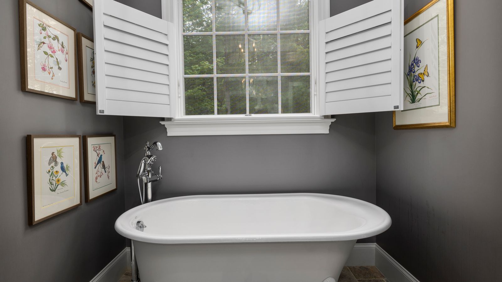 Modern bathroom with a walk-in shower and glass panel next to a soaking tub