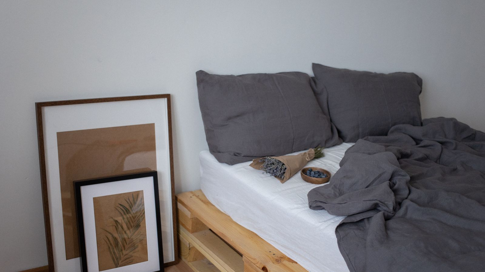 Linen bed sheet with natural wrinkled texture on a mattress